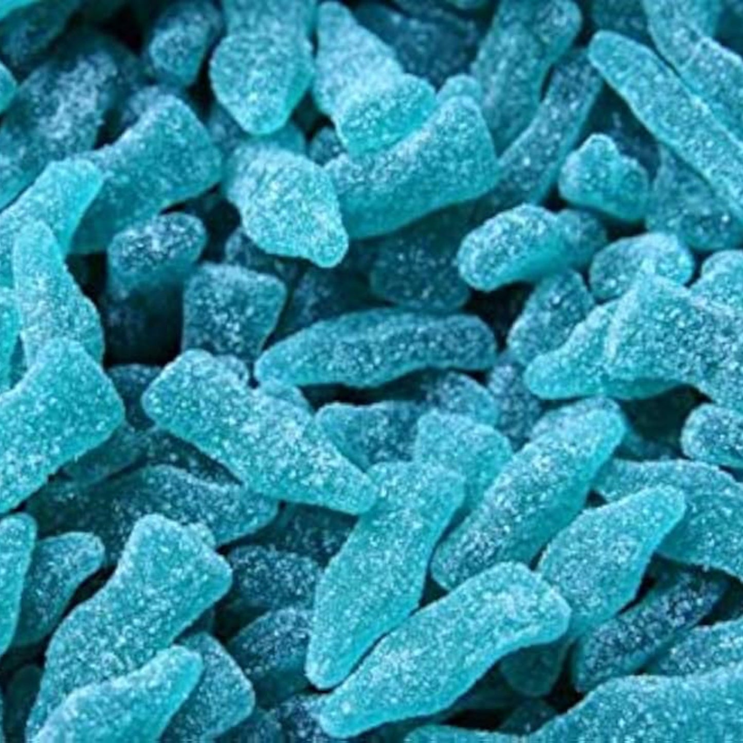 Close-up of blue gummy bottles