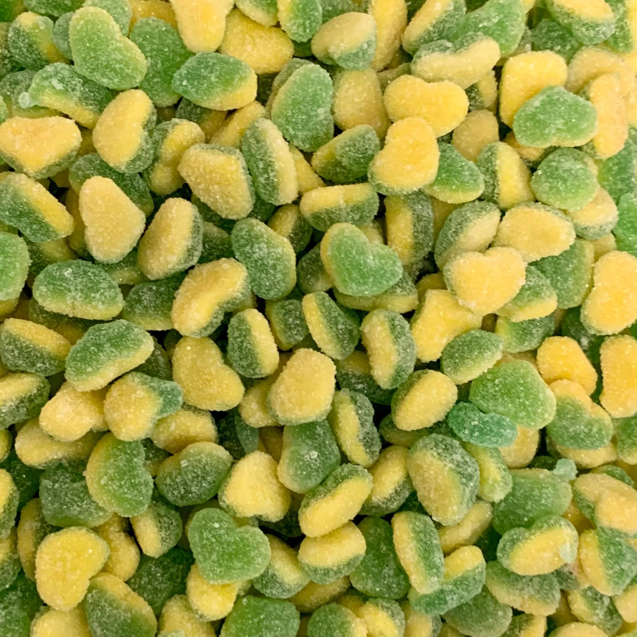 Close-up of green and yellow heart-shaped candies.