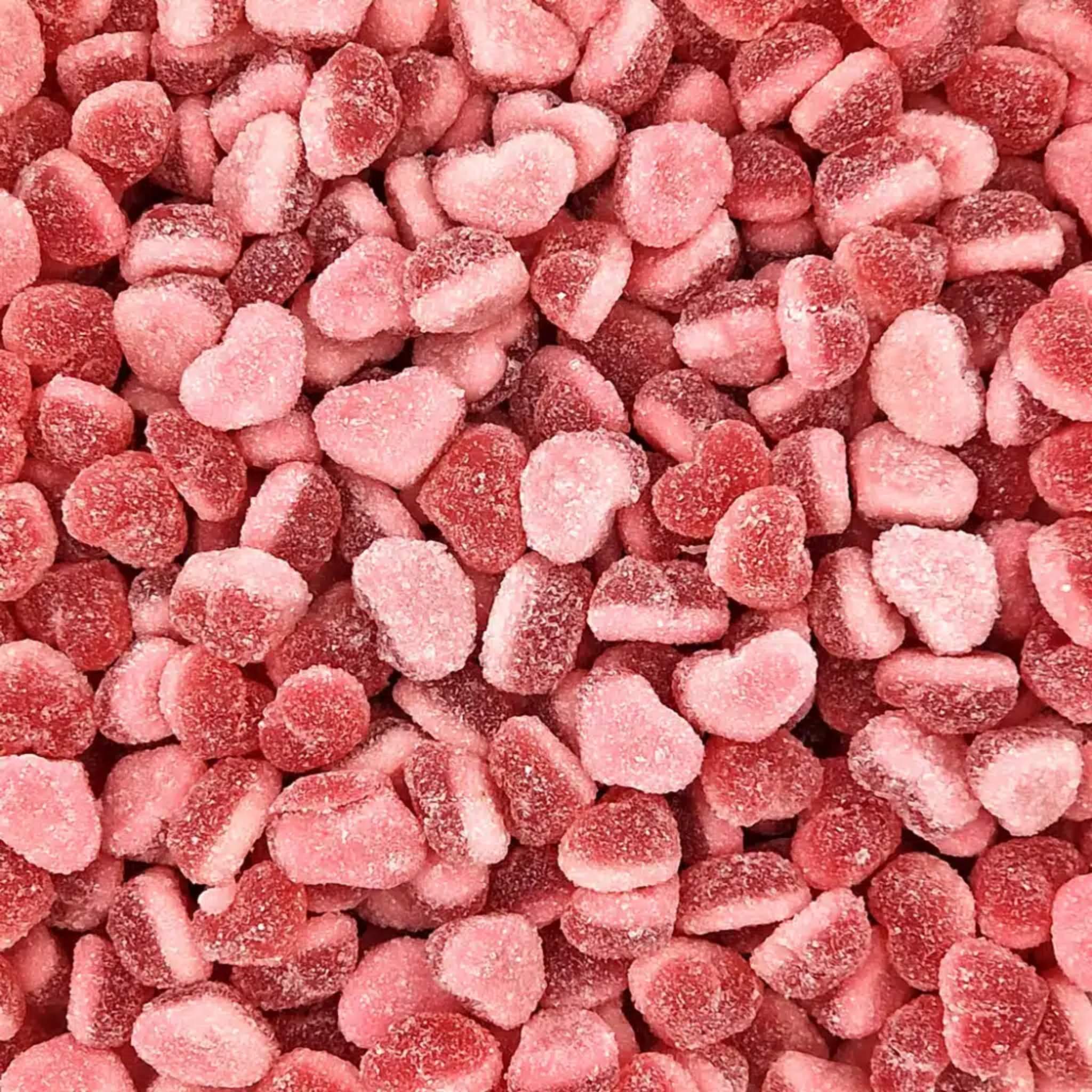 Close-up of pink heart-shaped gummy candies.