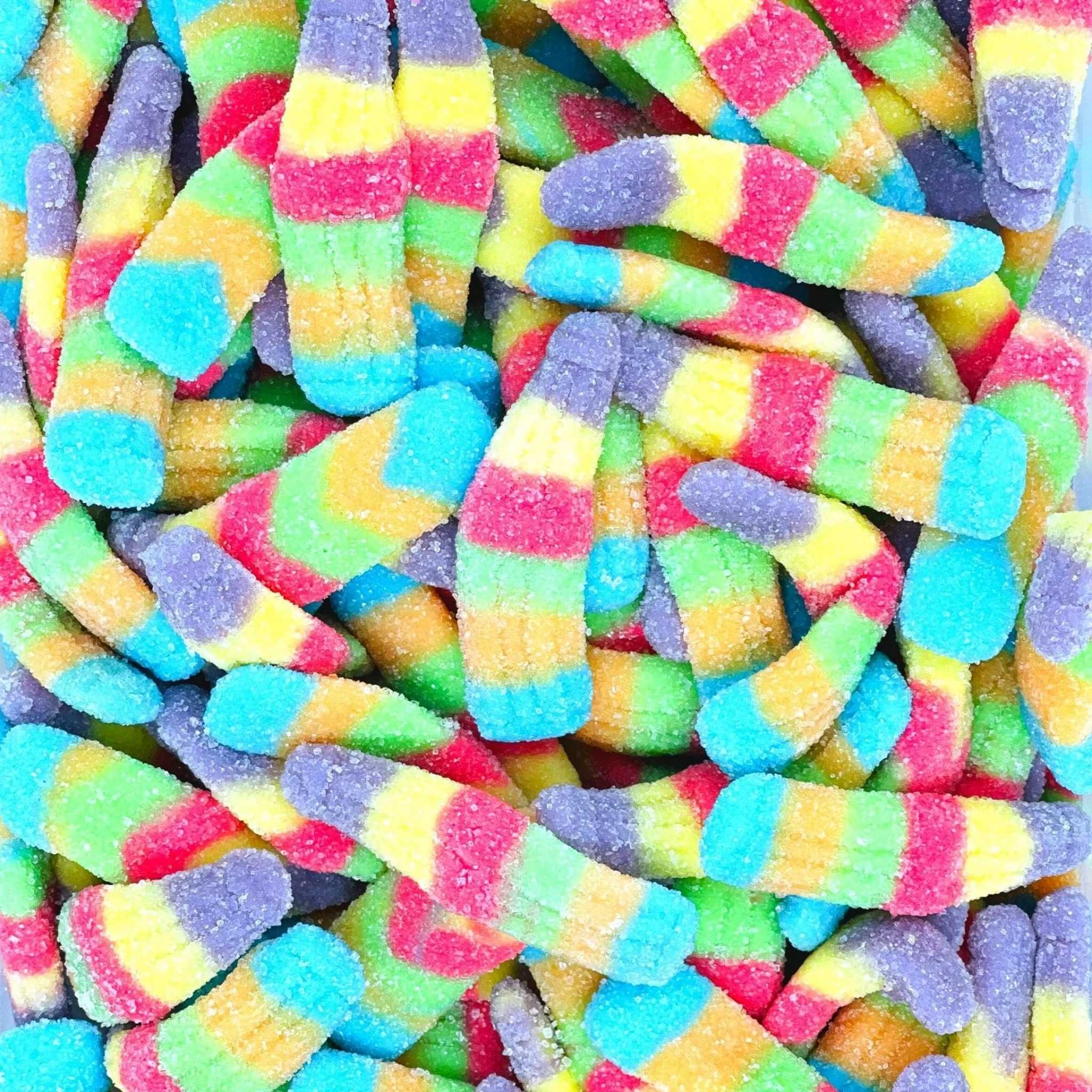 Colourful gummy bottles stacked together